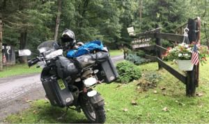 Motorcycle in front of Horn Camp sign